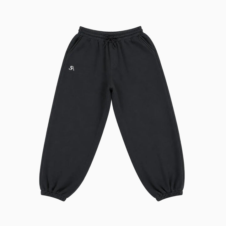 Black jogger sweatpants with an elastic drawstring waist and elastic cuffs, featuring a small white stylized logo on the left hip, shown against a plain white background.