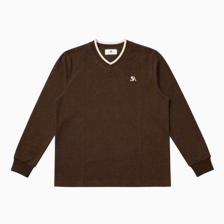 Brown long-sleeve shirt with a small logo on a white background