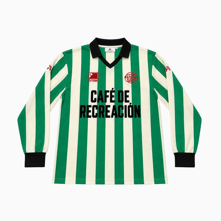 A long-sleeve striped soccer jersey with green and off-white vertical stripes, a black V-neck collar, black cuffs, and &