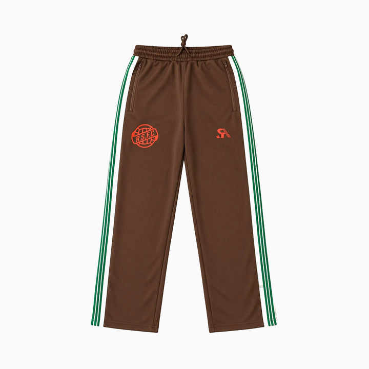 Brown track pants with green and white side stripes, featuring a red circular &